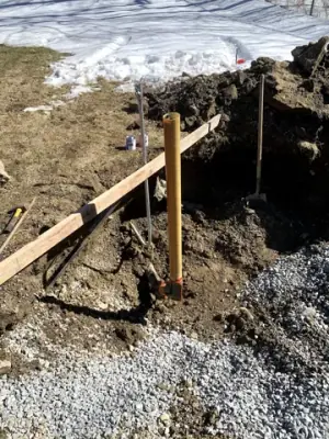 Pipe risers and buried services exposed during excavation.