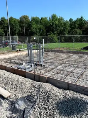 Reinforcing steel in the prepared concrete foundation forms.