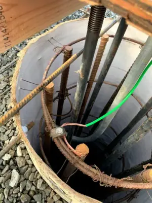 Underground connections inside an open containment chamber.