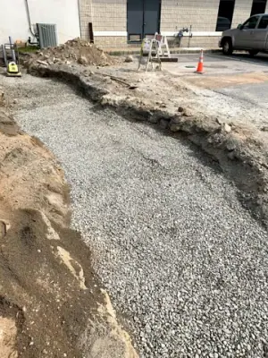 Backfilled utility route between the building and fueling area.