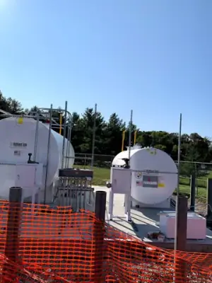Aboveground tanks and dispensing equipment positioned on the concrete foundation.