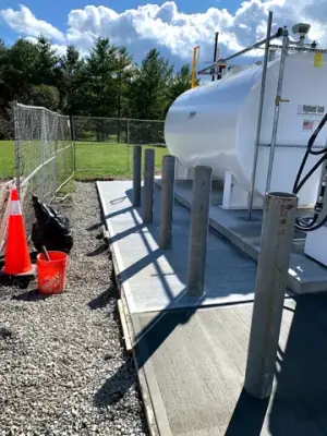 Aboveground tank, dispensing equipment, and protective posts.