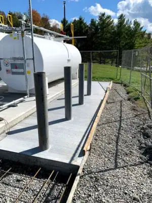 Aboveground tank, dispensing equipment, and protective posts.