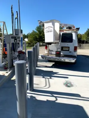 Dispensing equipment and protective posts along the fueling lane.