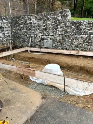 Timber foundation forms around the excavated tank-area services.