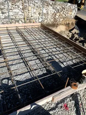 Reinforcing steel and timber formwork prepared for concrete placement.