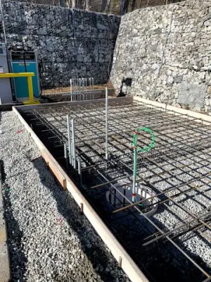 Reinforcing steel and timber formwork prepared for concrete placement.