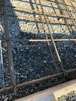 Reinforcing steel and timber formwork prepared for concrete placement.