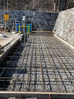 Reinforcing steel and timber formwork prepared for concrete placement.