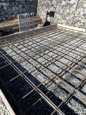 Reinforcing steel and timber formwork prepared for concrete placement.