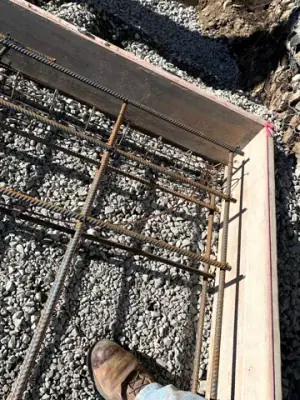 Reinforcing steel and timber formwork prepared for concrete placement.