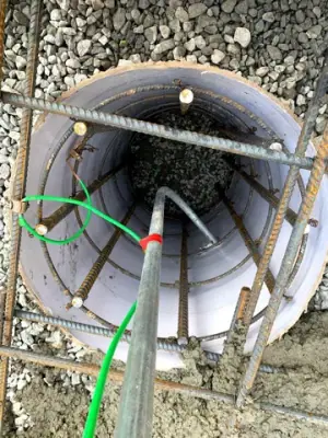 Open containment chamber with internal conduits and connections.