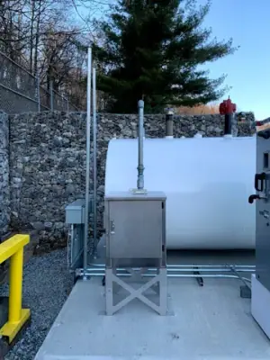 Close views of dispensing equipment and tank-side access hardware.