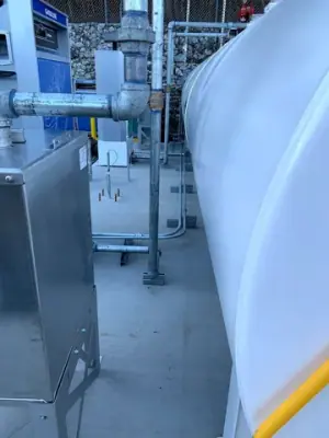 Close views of dispensing equipment and tank-side access hardware.