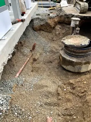 Exposed underground services beside the dispensing equipment.