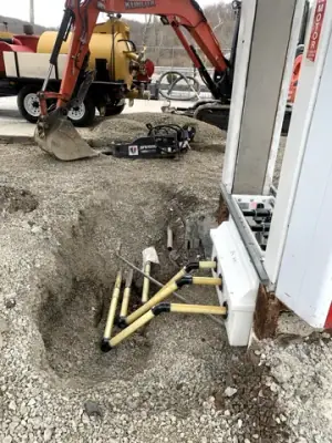 Exposed equipment-base connections beside a canopy column.