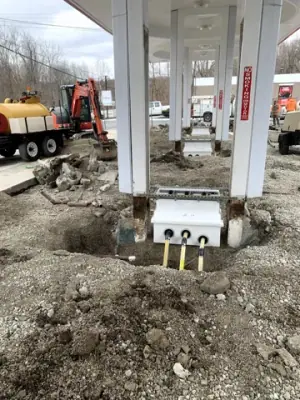 Exposed equipment-base connections beside a canopy column.