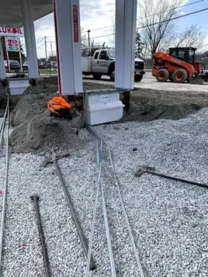 Conduit bends routed from the main trench toward the equipment bases.