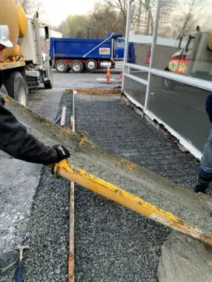 Aggregate spread within forms beside the storefront walkway.