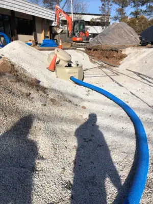 Curving blue piping routes across the prepared work area.