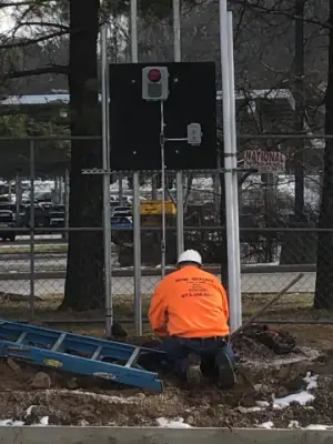 Technician working at an open dispenser base.