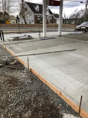 New concrete slab along the fueling-island approach.