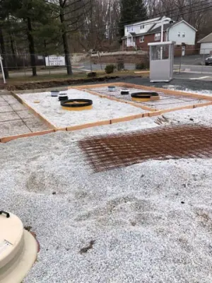 Tank access openings within the reinforced concrete formwork.
