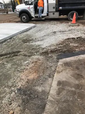 Prepared forecourt base beside a service truck.