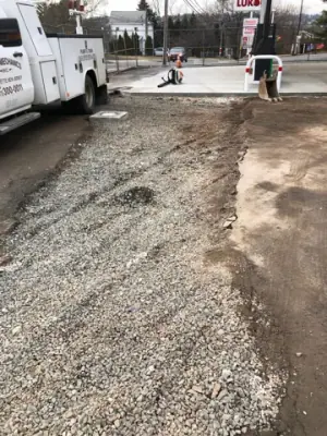 Aggregate surface along the edge of existing pavement.