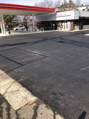 Resurfaced drive aisle beneath the station canopy.
