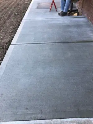 Close view of finished concrete sidewalk panels.