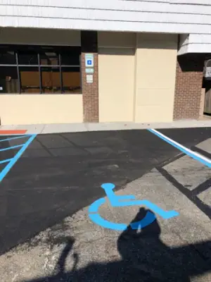 Accessible parking space in front of the building entrance.