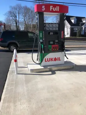 Lukoil dispenser numbered 5 on its concrete island.